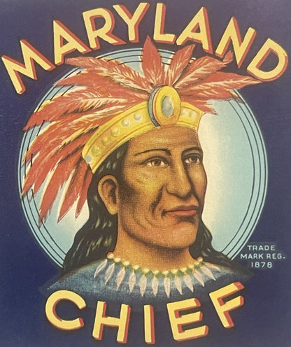 Close-up of the Maryland Chief can label: a chief in a red feathered headdress against a pale moon, MARYLAND CHIEF in gold on navy, TRADE MARK REG. 1878