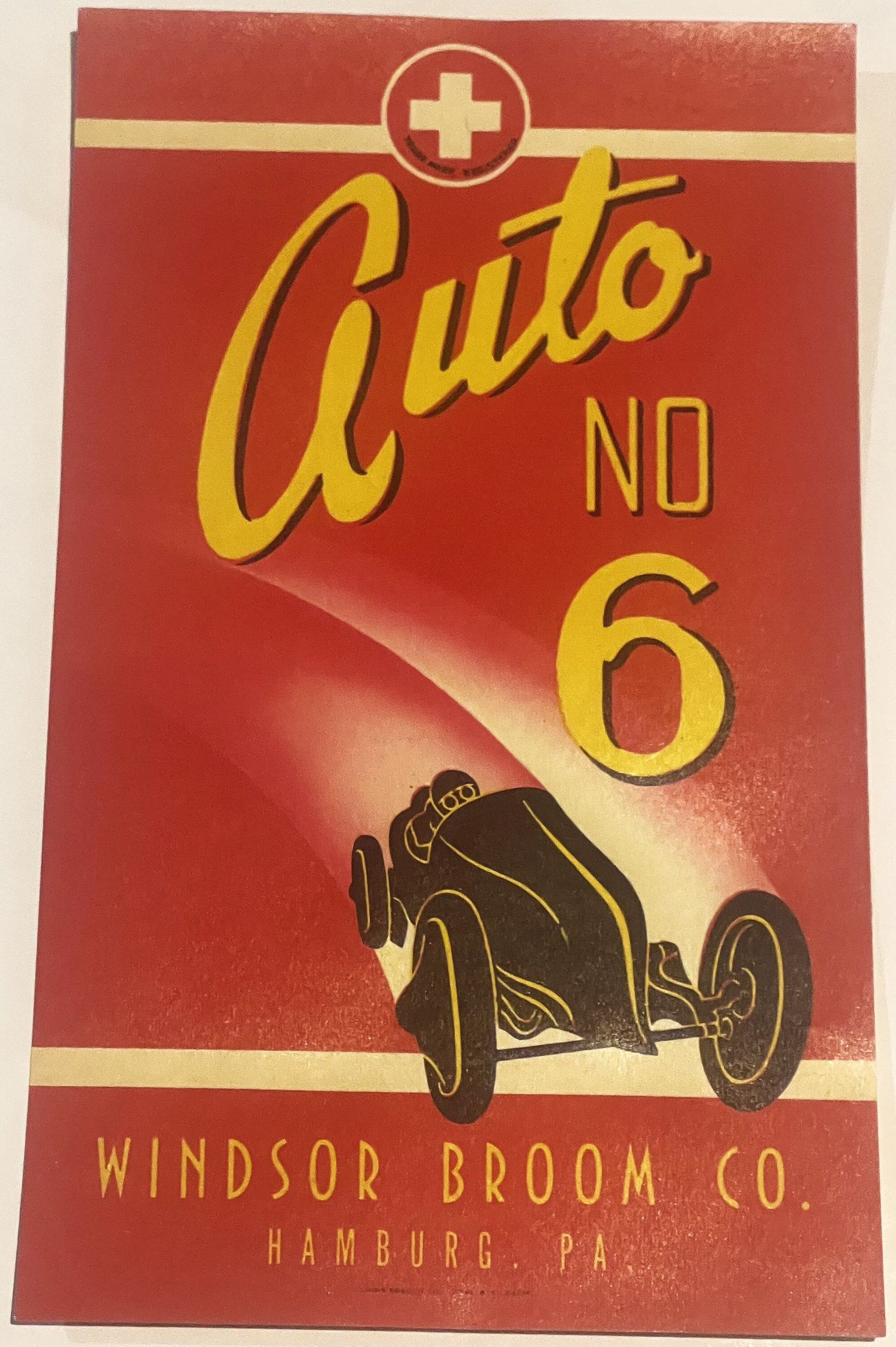 Vintage red broom label with yellow "Auto No 6" text, racing car illustration, and gold cross symbol, Windsor Broom Co Hambur