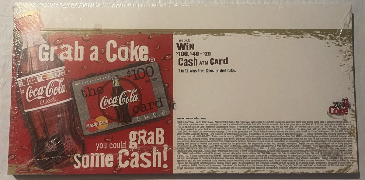 Sealed 1998 Coca-Cola promotional display box featuring red packaging with bottle imagery and "Grab a Coke Grab some Cash" te