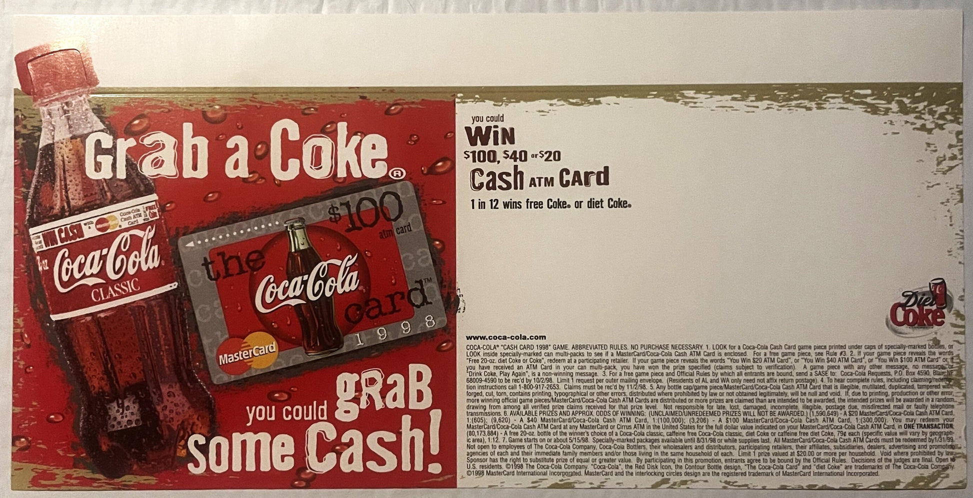 Vintage 1998 Coca-Cola promotional display with red background showing classic bottle, MasterCard ATM card, and "Grab a Coke 