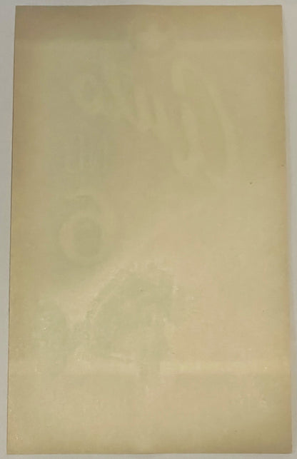 Blank cream-colored vintage broom label, back side shown, with subtle wear and age spots visible
