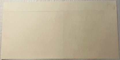 Blank cream-colored envelope or card with fold line at top, photographed flat against white surface