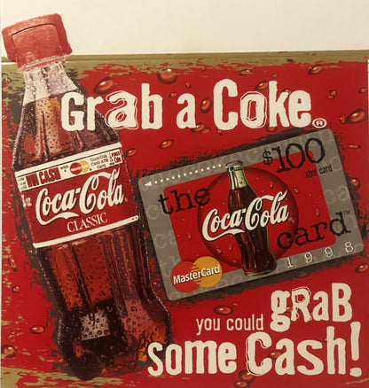 Vintage 1998 Coca-Cola promotional display with bottle and $100 MasterCard gift card against red background with "Grab a Coke