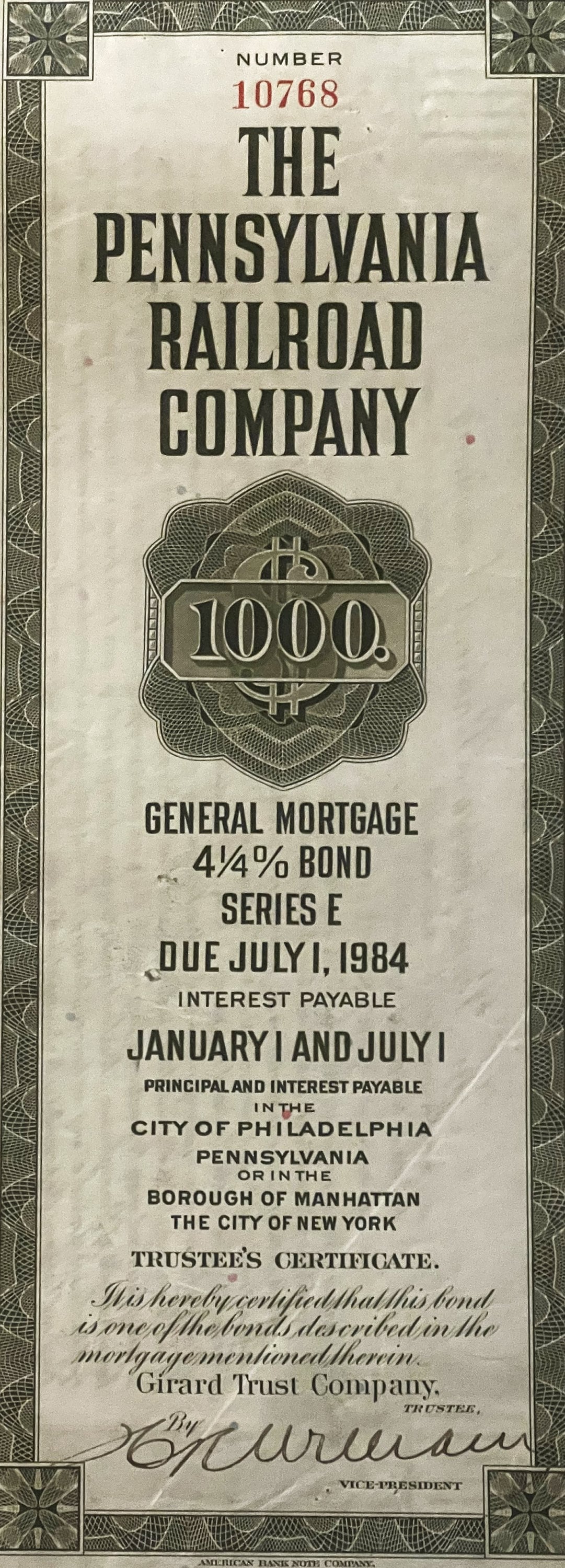 Cream-colored vintage bond certificate for Pennsylvania Railroad Company showing $1000 General Mortgage 4¼% Bond Series E, wi