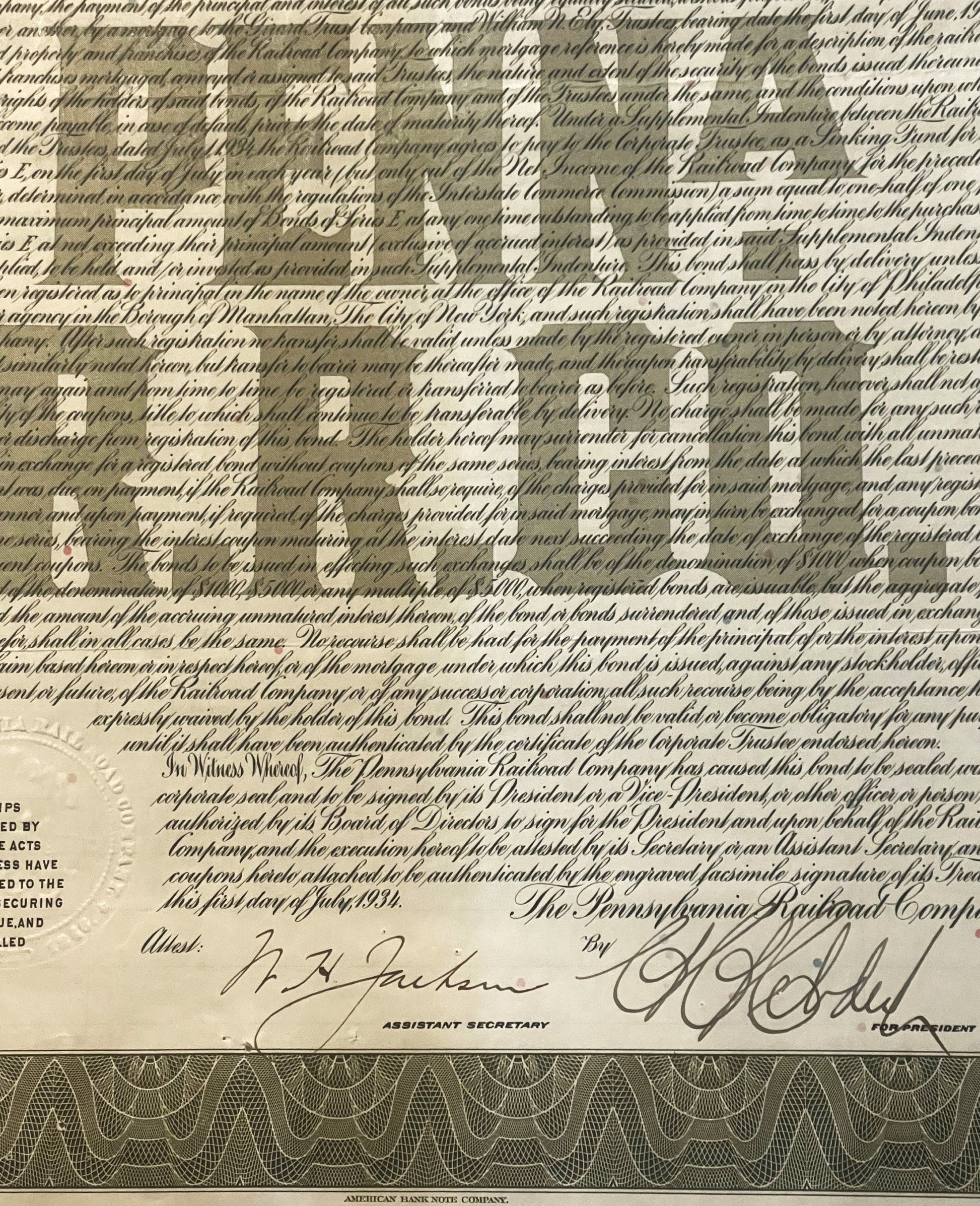 Vintage 1934 Pennsylvania Railroad $1000 gold bond document with ornate borders, signatures, and decorative coupon sheet at b