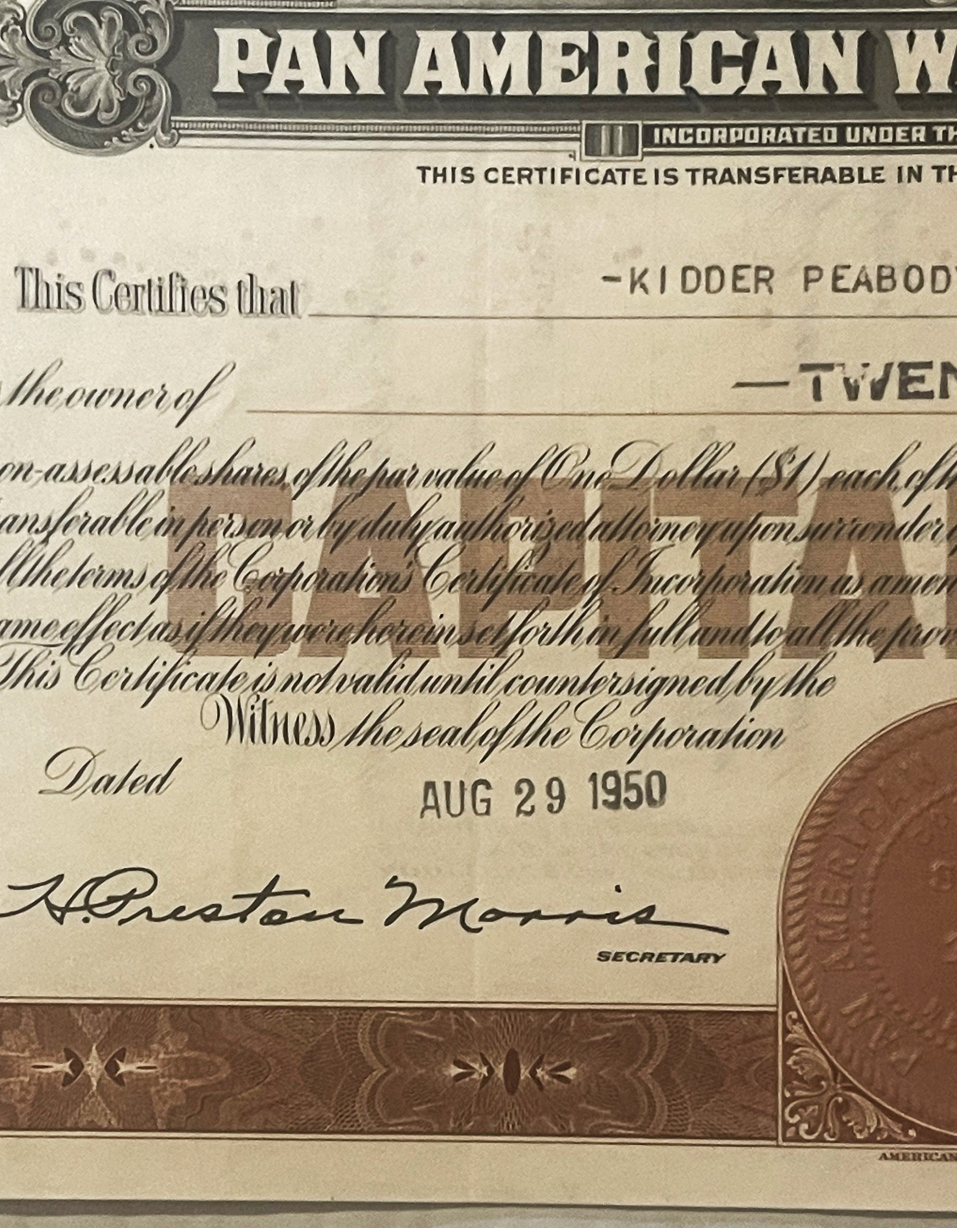 Vintage Pan American Airways stock certificate, showing ornate border design, cream and brown coloring