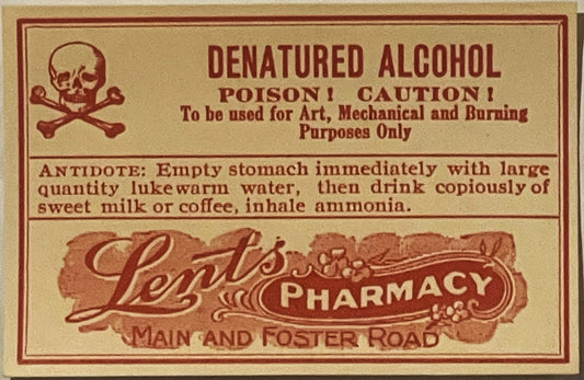 Vintage denatured alcohol poison label from Lents Pharmacy, Portland OR, with skull and crossbones symbol, tan background wit