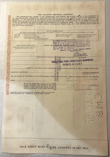 Cream-colored stock certificate from The Atlantic Refining Company with printed text, abbreviation key, and signature lines, 