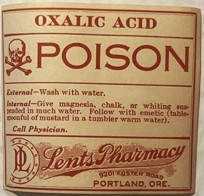Vintage poison label for oxalic acid from Lents Pharmacy in Portland, Oregon, with skull and crossbones symbol and red text o