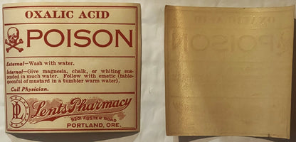 Vintage oxalic acid poison label from Lents Pharmacy in Portland with skull and crossbones symbol, shown front and back on cr