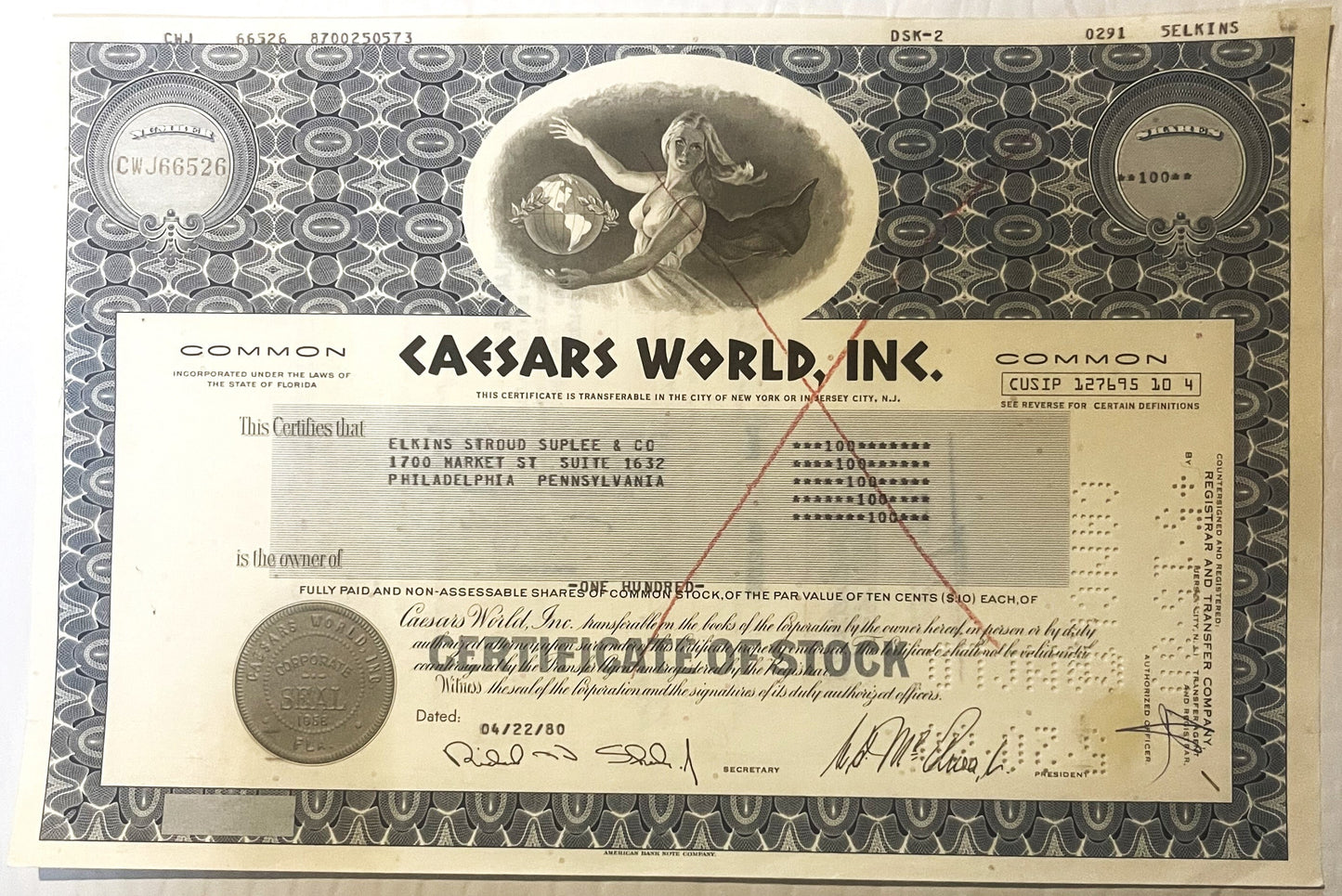 Vintage Caesars World Inc stock certificate showing ornate border design, allegorical figure holding globe, and corporat