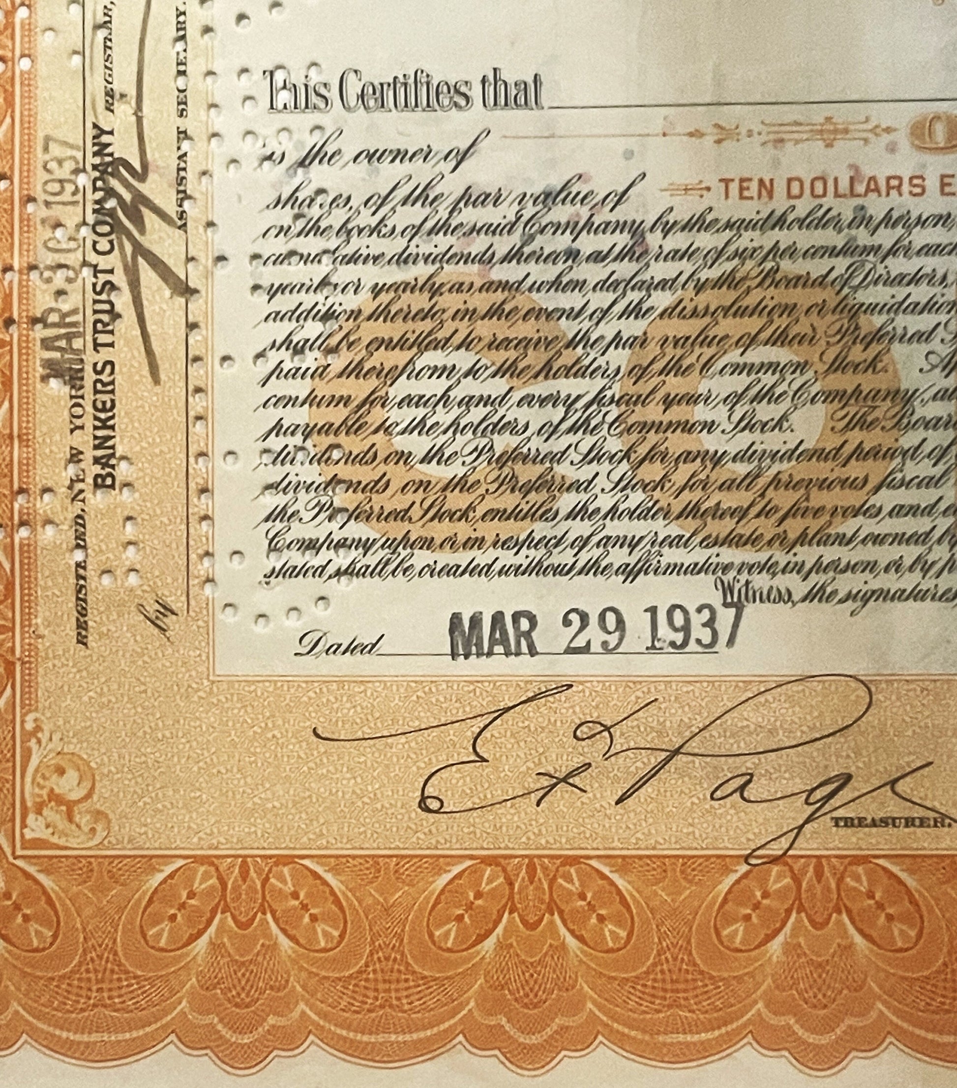 Close-up of vintage stock certificate dated MAR 29 with ornate orange border, cursive signature, and "TEN DOLLARS" text
