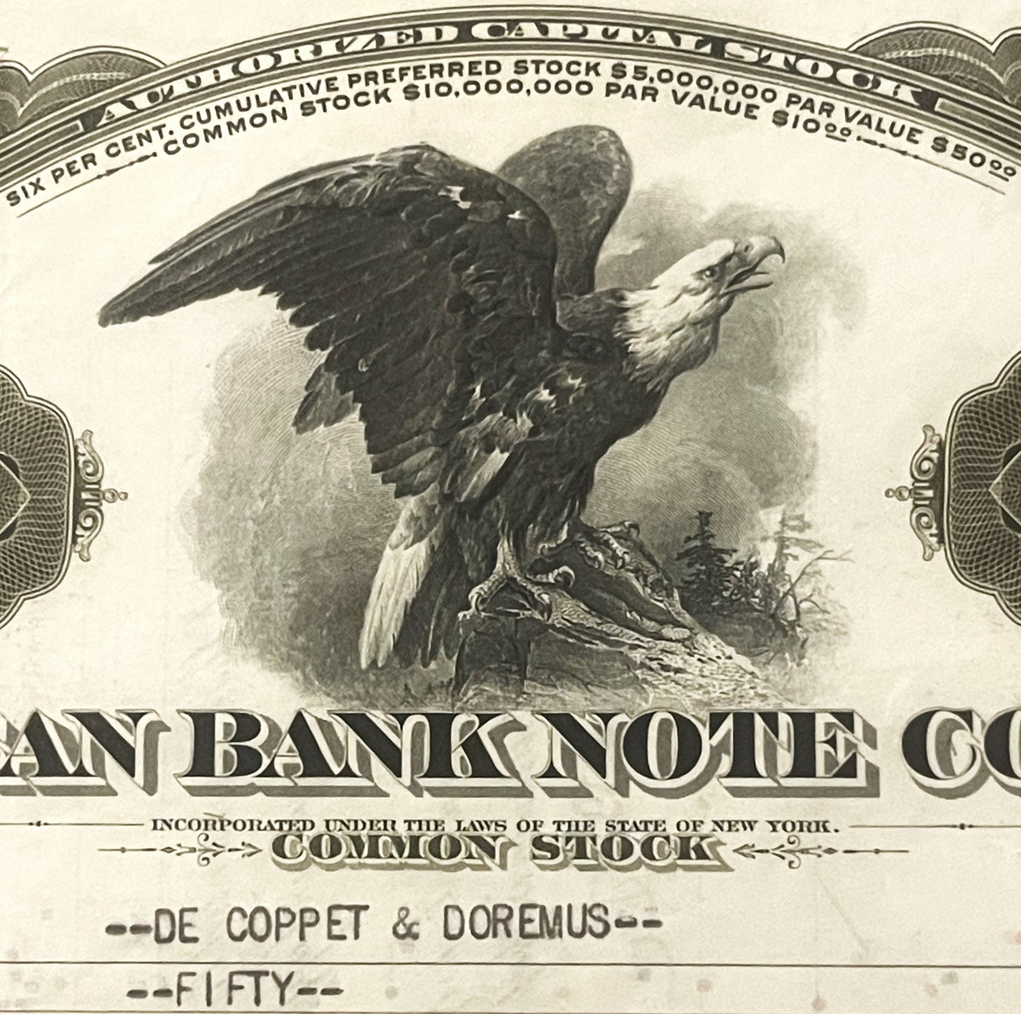 Antique bank stock certificate featuring engraved bald eagle vignette with spread wings perched on rocky outcrop, surrounded 