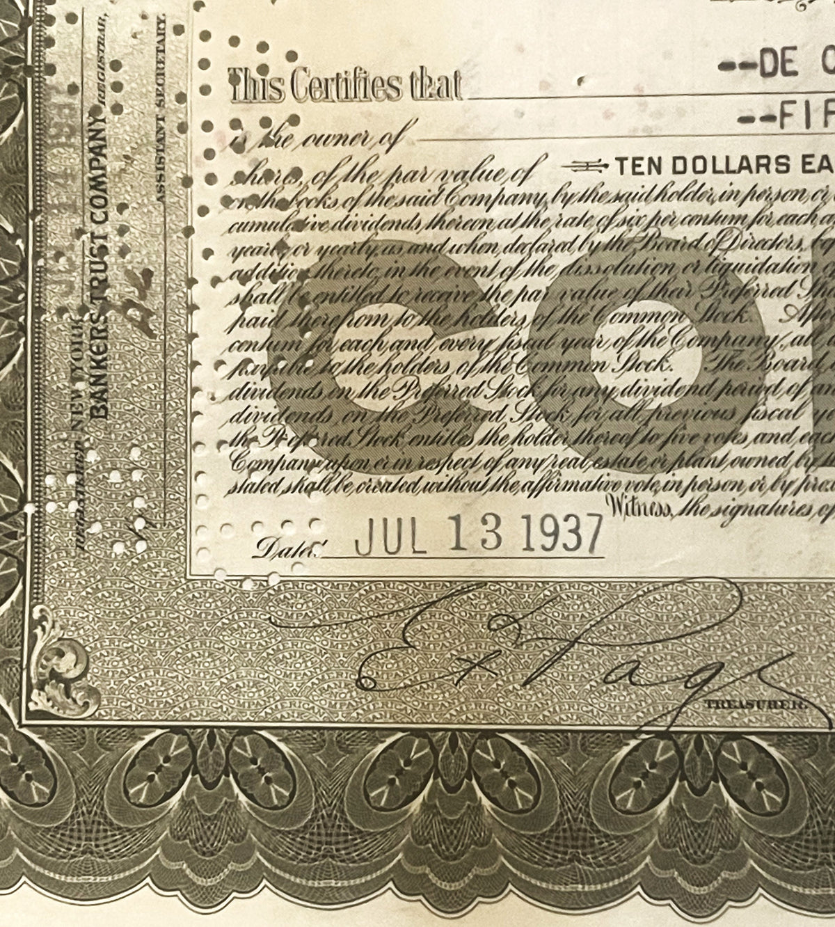 Close-up of vintage stock certificate, showing ornate border design, "Ten Dollars" text, and handwritten