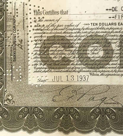 Close-up of vintage stock certificate, showing ornate border design, "Ten Dollars" text, and handwritten