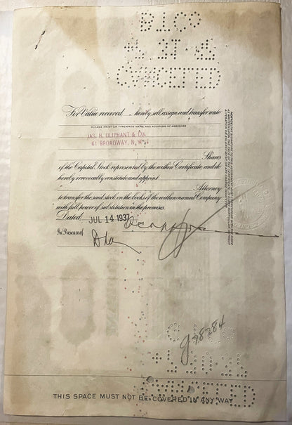 Aged stock certificate from with printed form, handwritten signatures, and perforated hole patterns, cream-colored paper
