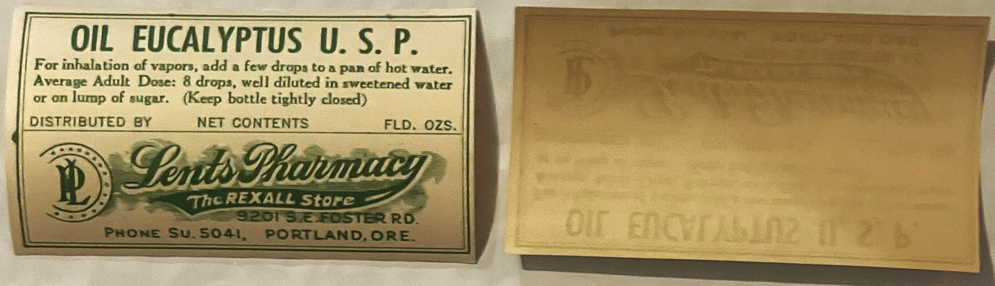 Vintage eucalyptus oil bottle label from Lents Pharmacy in Portland, Oregon, showing dosage instructions and net contents, di