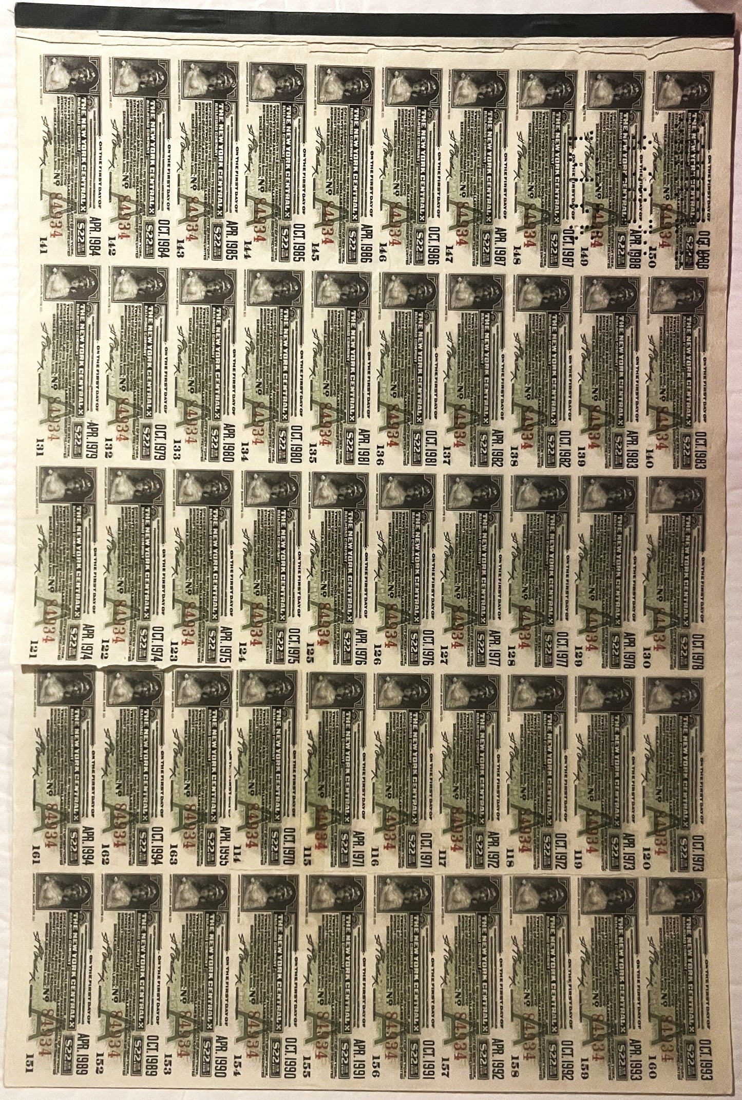 Sheet of vintage railroad bonds with portrait photographs and printed text arranged in rows, sepia-toned document on aged pap