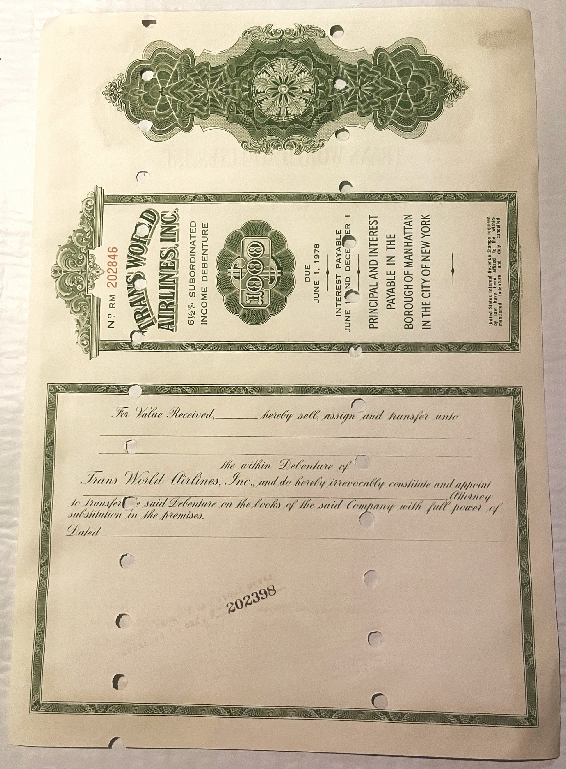 Vintage 1961 TWA Airlines $1000 debenture bond certificate with green ornamental header and transfer text, displayed flat on 