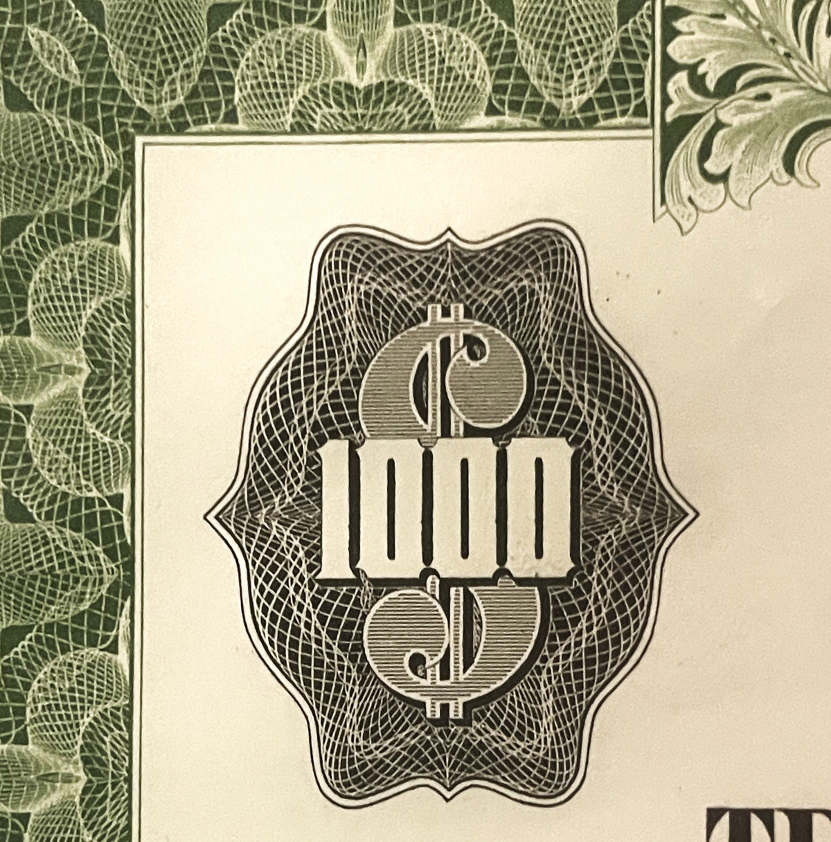 Ornate vintage bond certificate detail showing dollar sign symbol within decorative frame and crosshatch background, green le