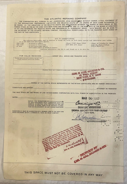 Cream-colored Atlantic Refining Company stock certificate with red stamps, signatures, and company seals, dated MAR 30 1