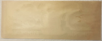 Blank cream-colored vintage can label with faint embossed text, photographed flat against white background