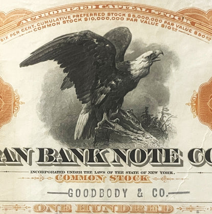 Vintage American Bank Note Company stock certificate with bald eagle illustration, ornate orange and tan borders, and text re
