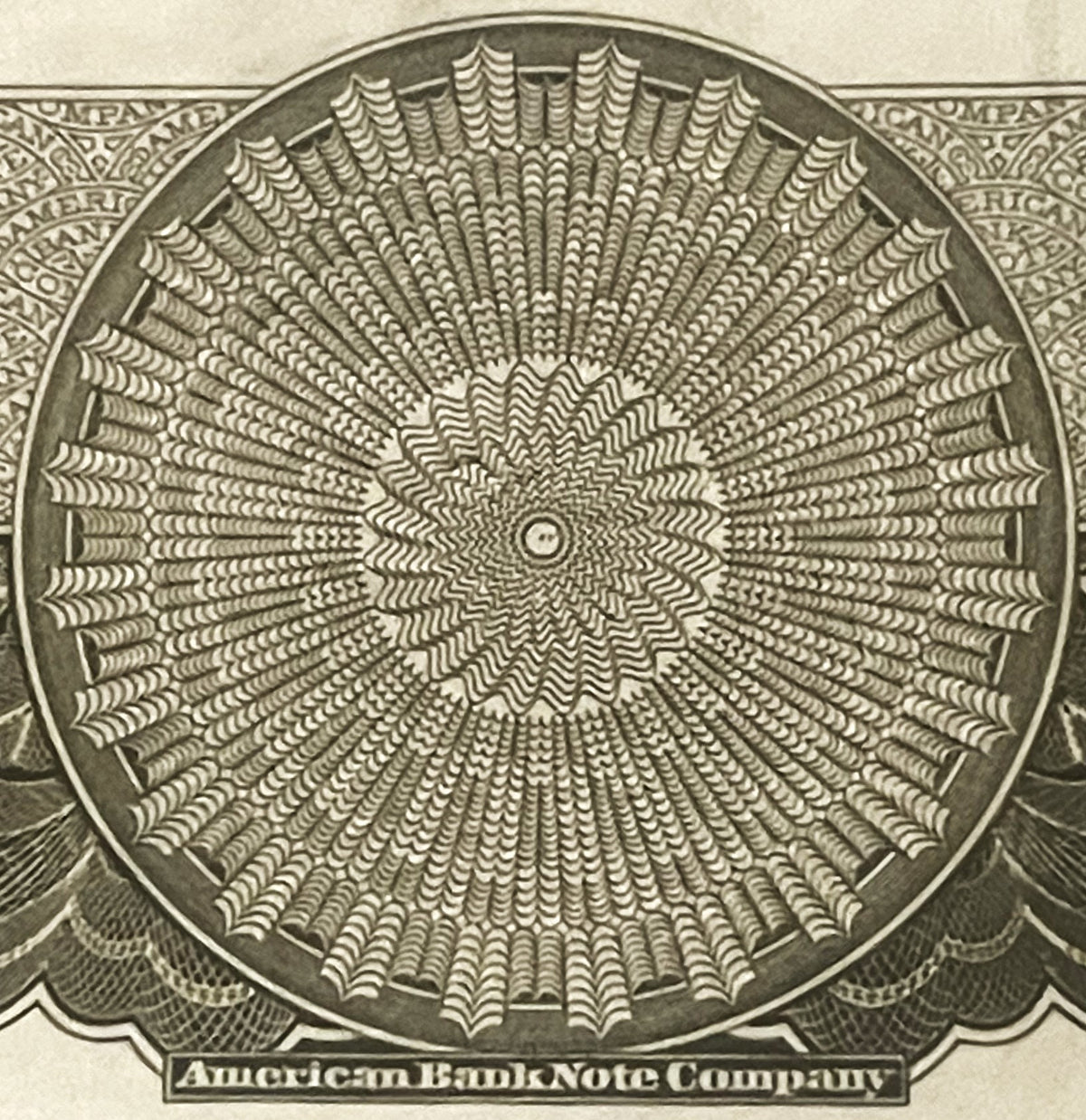 Close-up of intricate circular geometric pattern from American Bank Note Company stock certificate vignette, printed in green