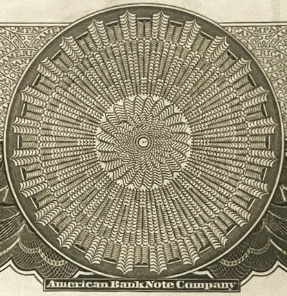 Close-up of intricate circular geometric pattern from American Bank Note Company stock certificate vignette, printed in green