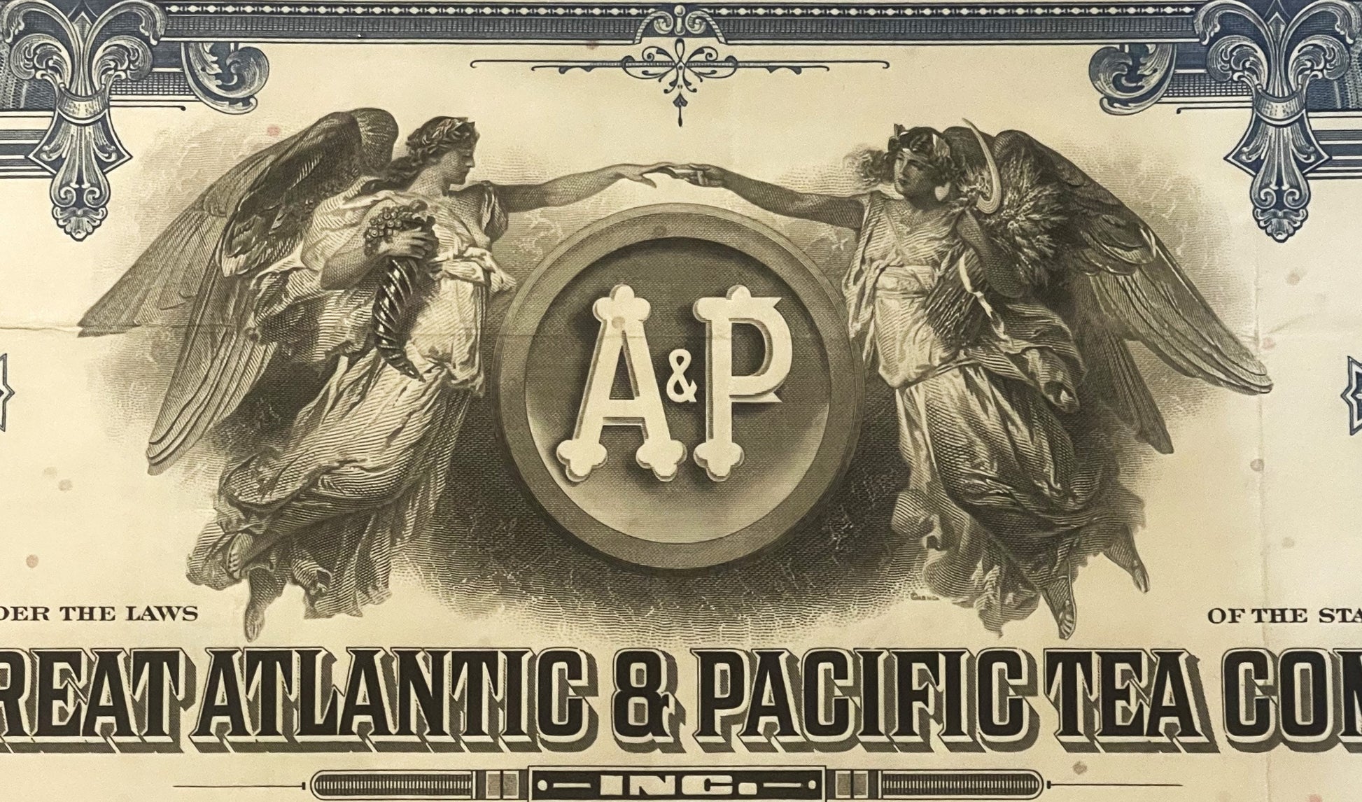 Ornate vintage stock certificate header with "A&P" monogram in circular seal flanked by two winged angels, cream and sepia to