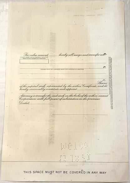 Blank vintage stock certificate form with ornate cursive text and printed instructions, cream-colored paper with braille at b