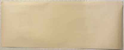 Blank cream-colored vintage can label with no visible printed text or imagery