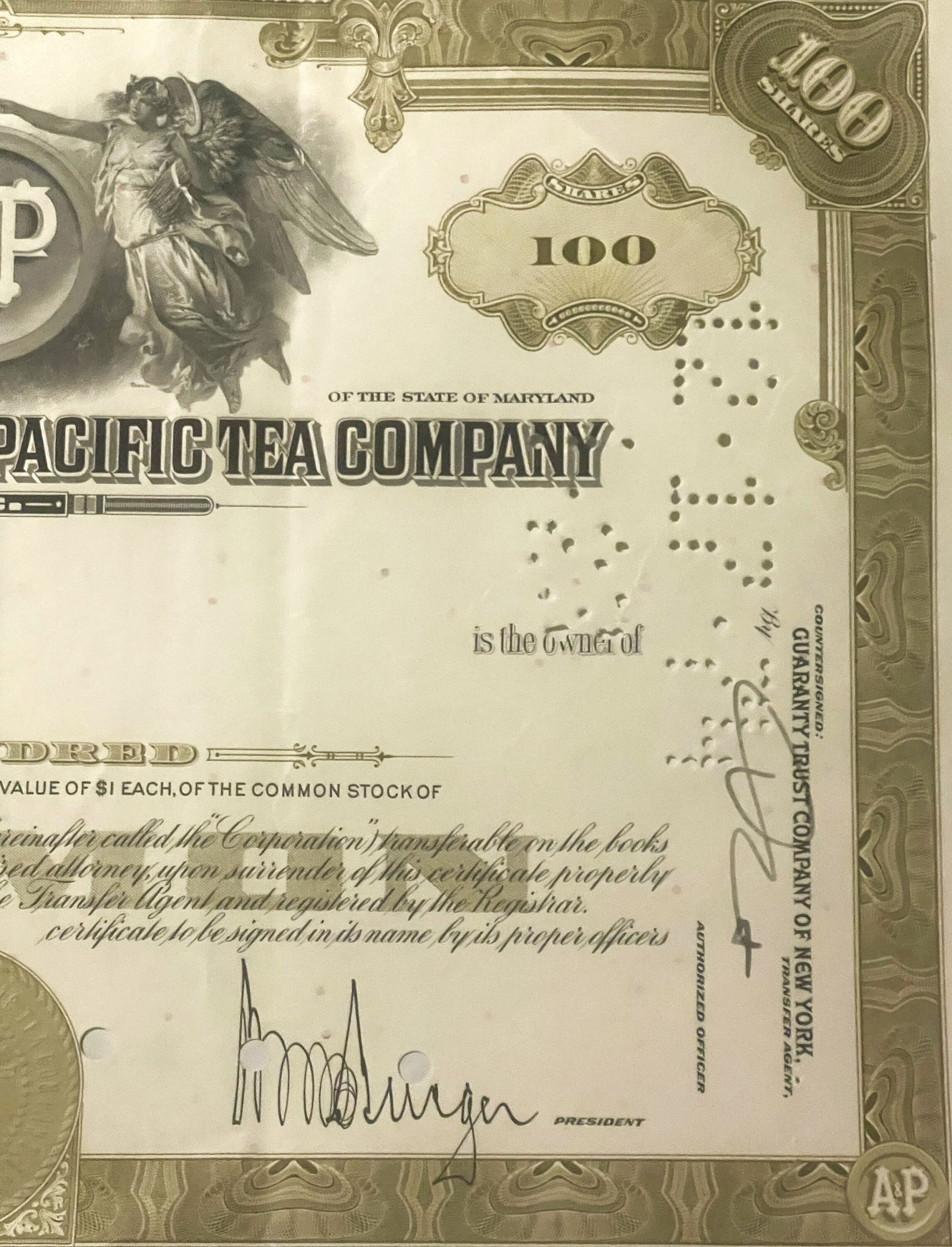 Vintage stock certificate for Pacific Tea Company of Maryland, 100 shares, cream-colored with ornate border and angel illustr