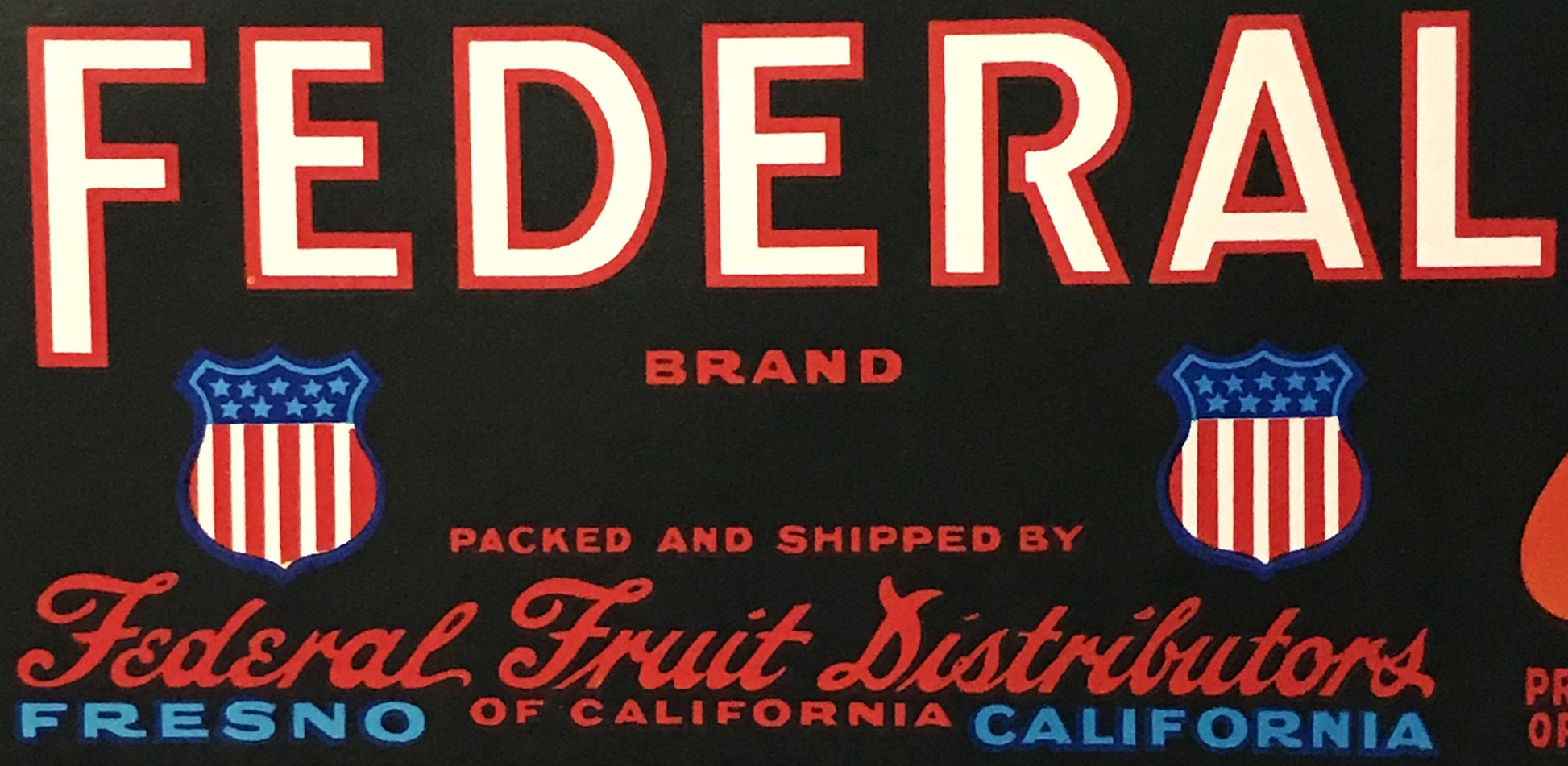 Vintage Federal fruit crate label with red and cream lettering, patriotic shield emblems, and text reading "Federal Brand" an