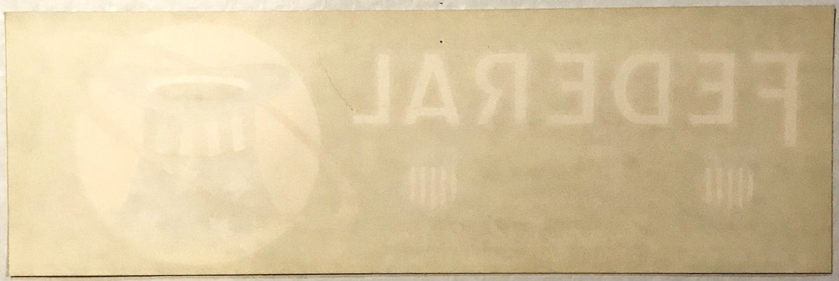 Faded vintage crate label with "PATRIOT" text visible at top, cream-colored paper with embossed or printed lettering, photogr