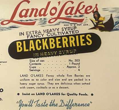 Vintage Land O'Lakes blackberries can label featuring red script logo, gondolier illustration, and black banner with yellow t