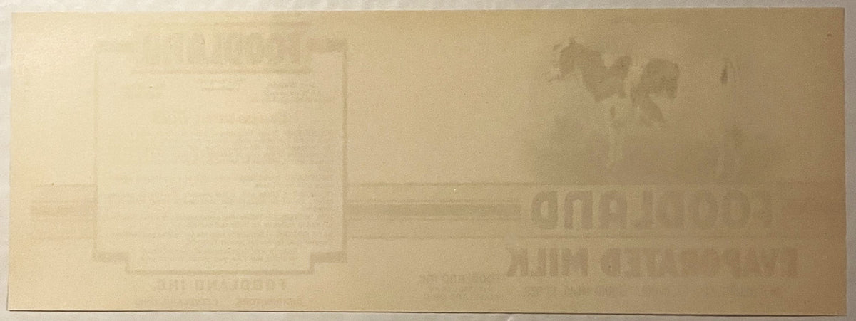 Reverse of the Foodland label: plain tan paper, the printing faintly showing through in mirror image.