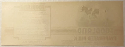 Reverse of the Foodland label: plain tan paper, the printing faintly showing through in mirror image.