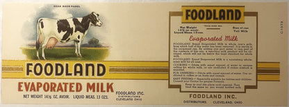 Antique Foodland evaporated milk label from Cleveland, Ohio, showing illustrated dairy cow, product details, and usage instructions printed in red and gold on cream background.