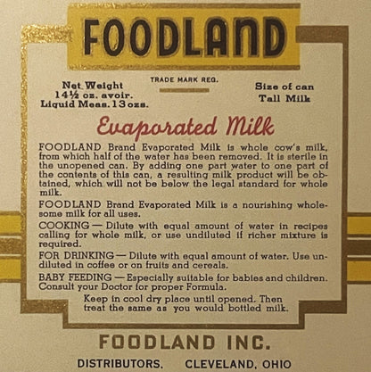 Antique Foodland evaporated milk label, tan and gold, featuring product information and usage instructions for cooking, drinking, and baby feeding. Distributed by Foodland Inc., Cleveland, Ohio.