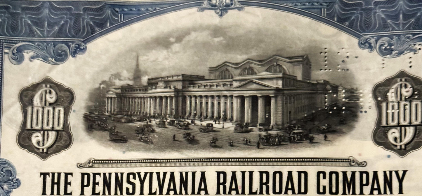Vintage Pennsylvania Railroad bond certificate featuring classical building with columns and ornamental borders in sepia tone