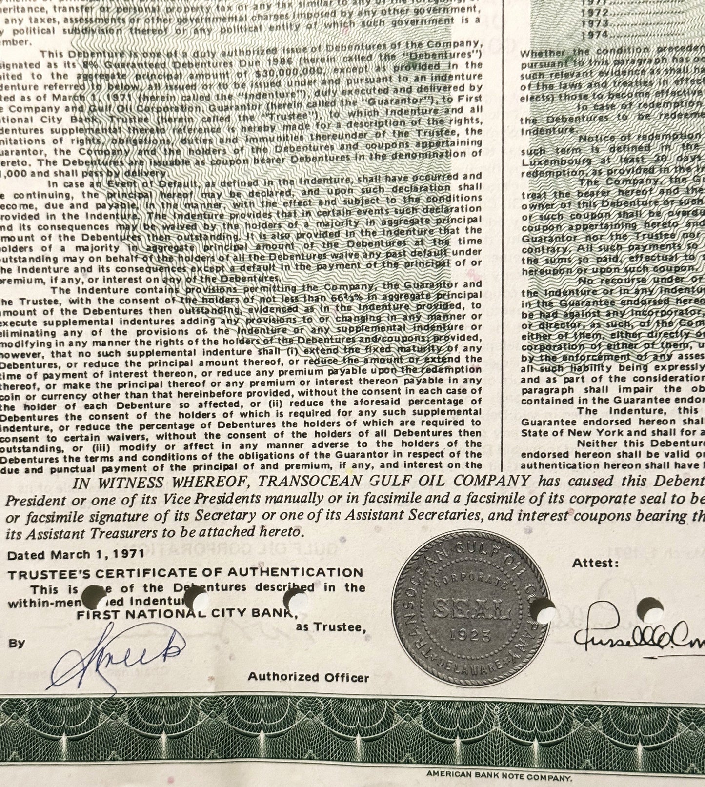 Close-up of 1971 Transocean Gulf Oil Company debenture bond with printed text, signatures, trustee certificate, and vintage s