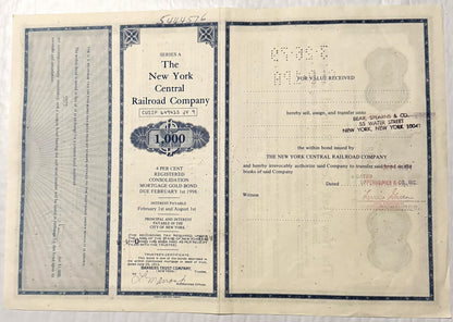 Three pages of a 1913 New York Central Railroad 1,000 gold bond certificate with ornamental borders, showing front cover, bon
