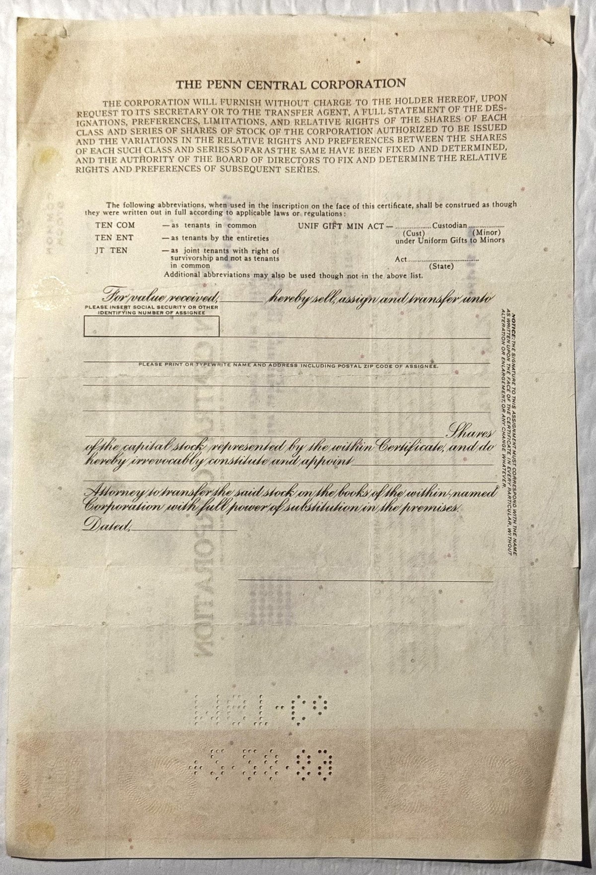 Blank Penn Central Corporation stock certificate form on aged cream paper with printed header, abbreviation key, and cursive 