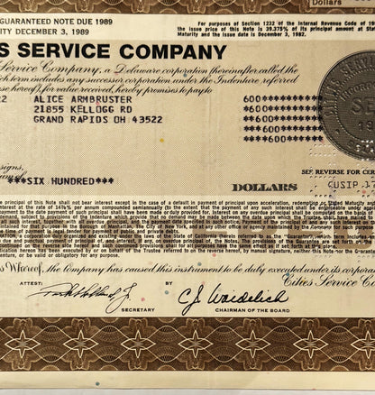Vintage Cities Service Company stock certificate with tan and brown security printing, showing payee name and address in