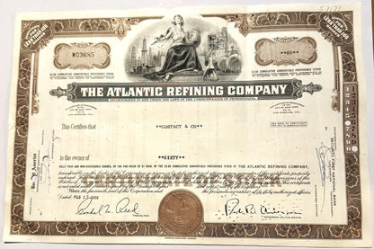 Ornate Atlantic Refining Company stock certificate in brown and cream with decorative border, central allegorical figure