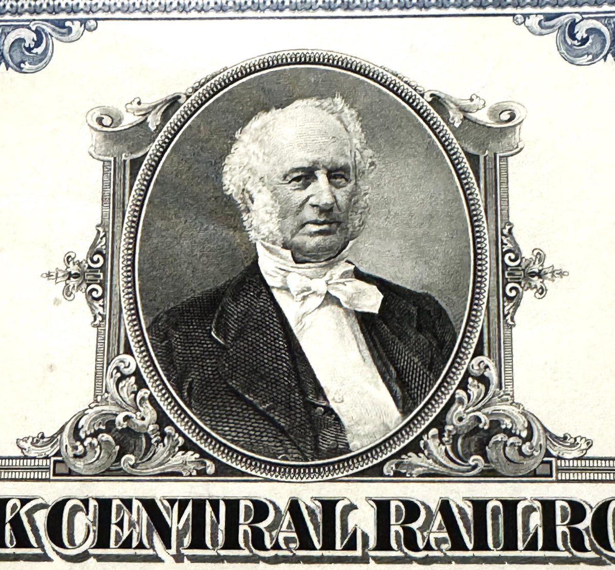 Engraved portrait of distinguished older man in formal black jacket and white bow tie within ornate oval frame, "CENTRAL RAIL