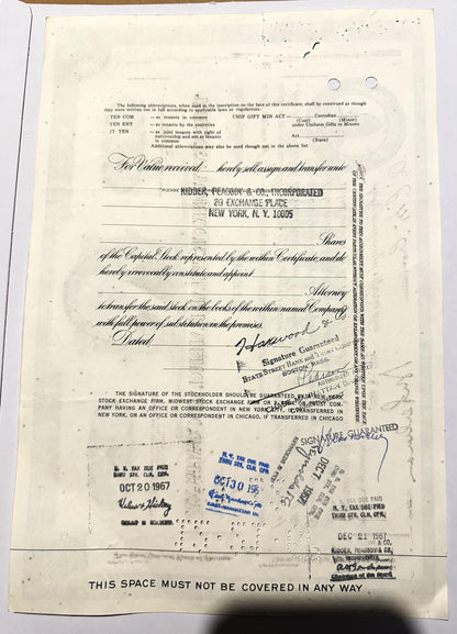 Aged stock certificate from Kidder, Peabody & Co. with blue ink stamps, signatures, and railroad company details v
