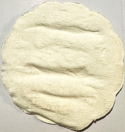 Cream-colored embossed cloth coaster with horizontal ribbed texture and rounded edges, showing a woman's profile drinking fro