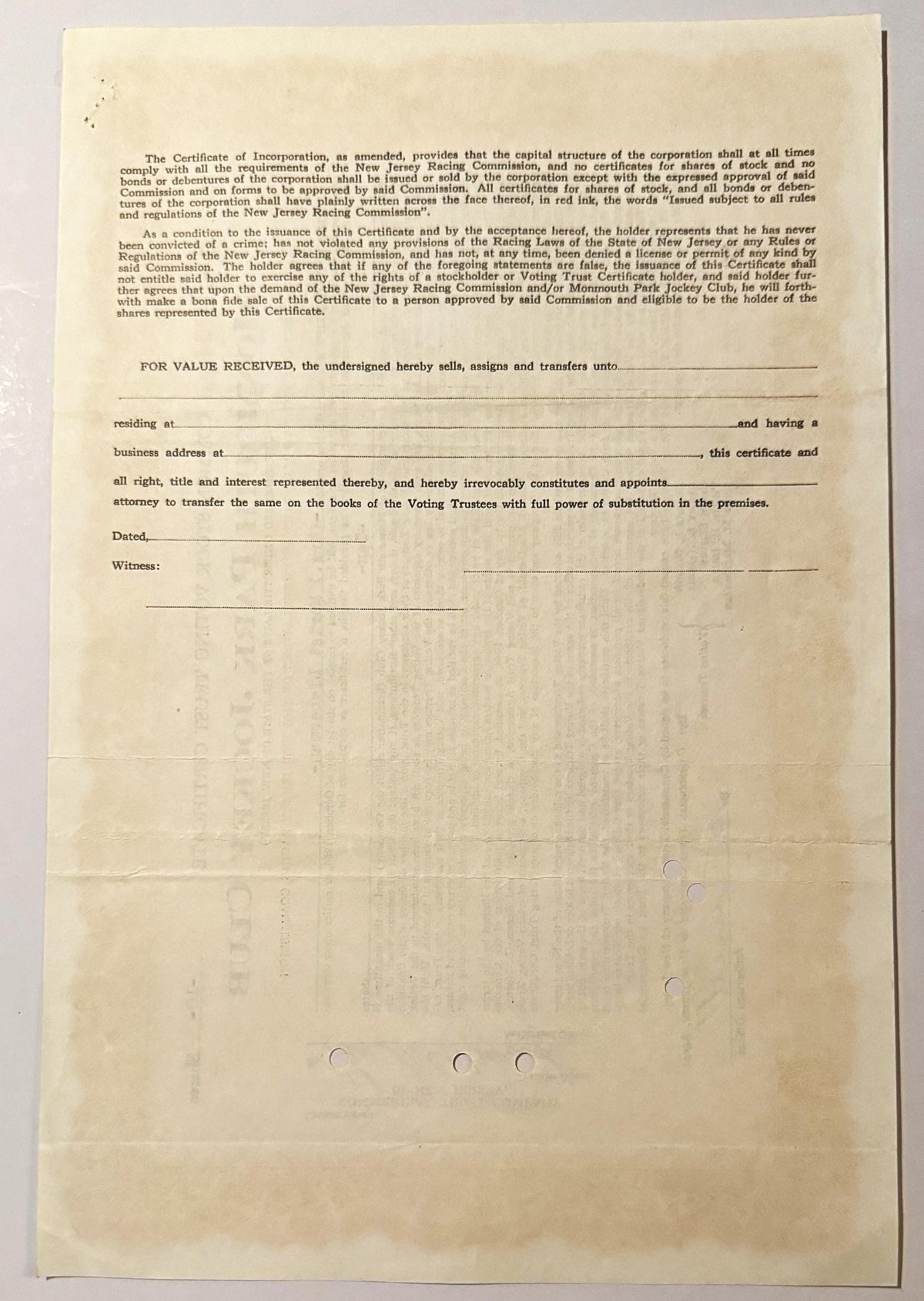 Aged cream-colored stock certificate page with printed legal text and blank signature lines, showing holes from binding or fi
